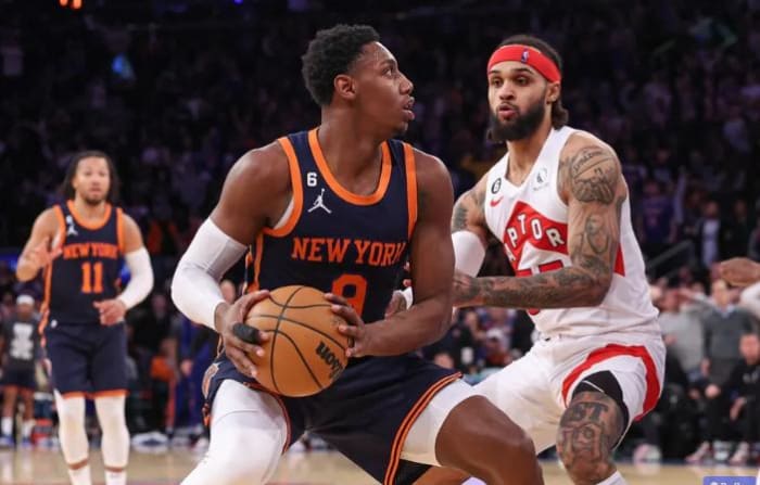 RJ Barrett (center) handles the ball in one of the Knicks' meetings with the Raptors last season